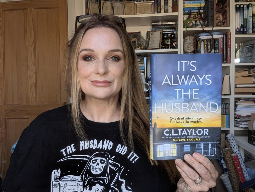 Author holding up a copy of her book