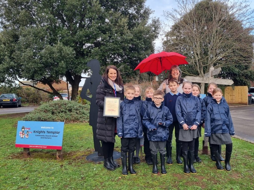 Knights Templar pupils try out their weatherproofs with Head Laura Weaver & Fiona Payne from Watchet Visitor Centre by Isobel Pring.