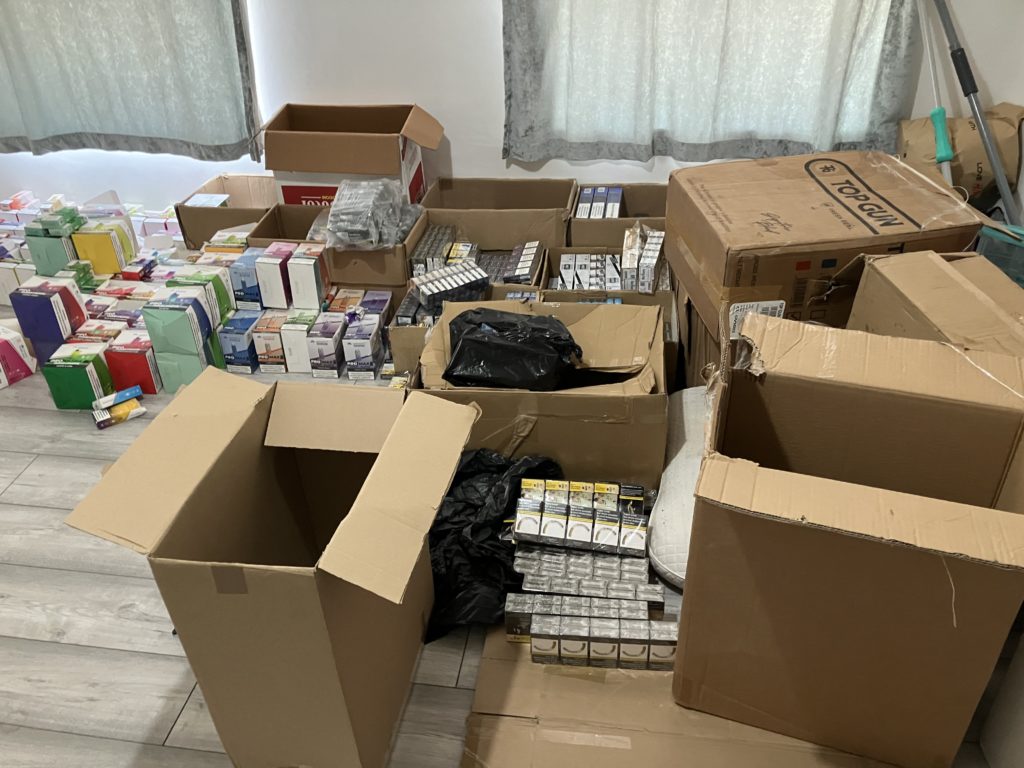 Open cardboard boxes and some of contents