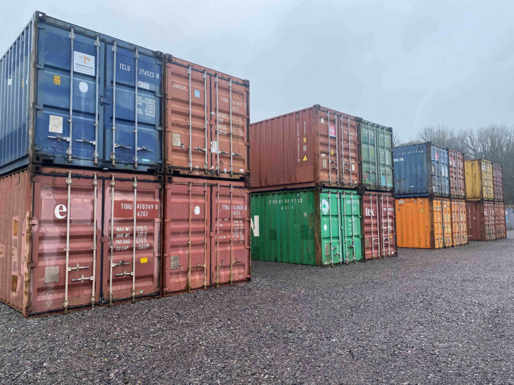 rows of shipping containers in blocks of 4