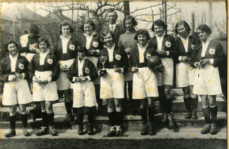Old black and white image of ladies football team
