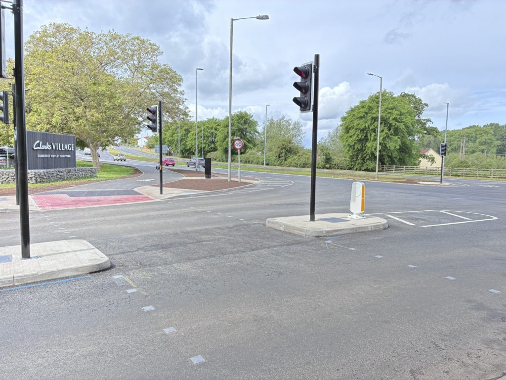 Crossroads on major road with traffic signals