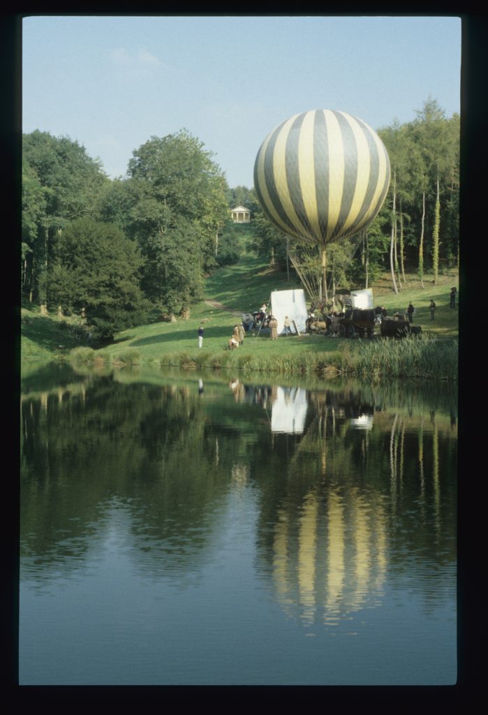 A hot air balloon next to a body of water during the filming of Pandaemonium in Hestercombe, Somerset.